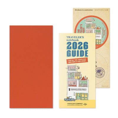 TRAVELER'S notebook Regular size insert 2026 Monthly planner.shown together with the TRAVELER'S notebook  2026 guide and sticker set