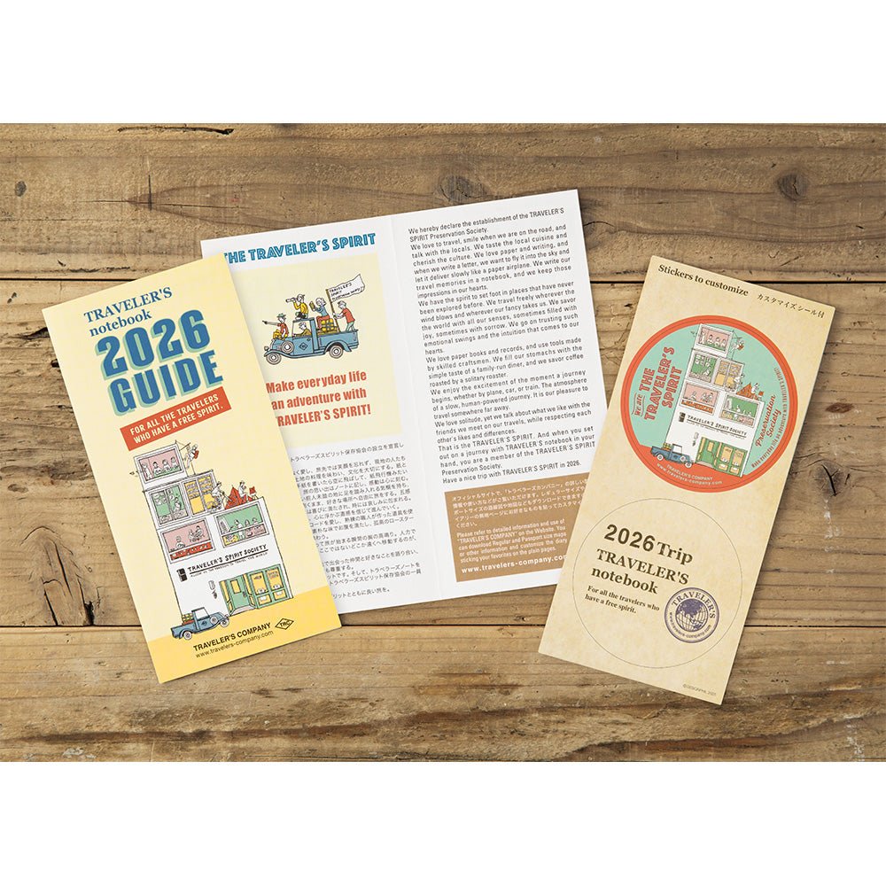 TRAVELER'S notebook Regular size insert 2026 Weekly memo planner with horizontal layout. Showing TRAVELER'S notebook 2026 guide and sticker set