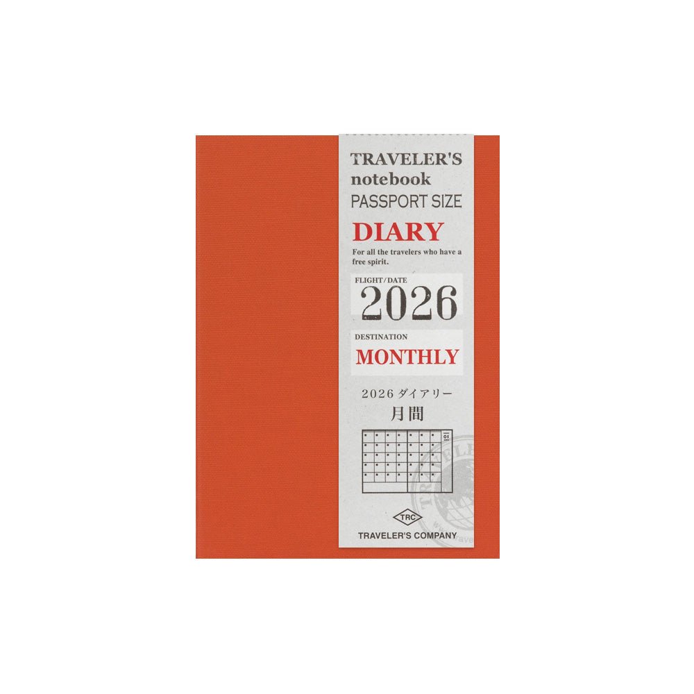 TRAVELER'S notebook Passport Size 2026 Monthly Planner insert. Shown orange card stock cover with label.