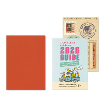 TRAVELER'S notebook Passport Size 2026 Monthly Planner insert. Shown orange card stock cover and included TRAVELER'S notebook 2026 Guide and sticker set