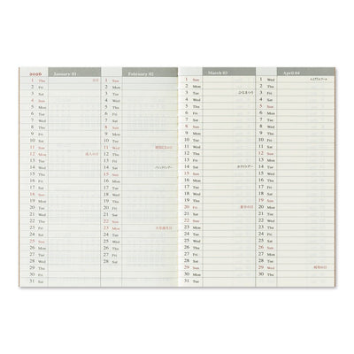 TRAVELER'S notebook passport size 2026 planner with horizontal week over two pages layout. Showing the yearly planning pages