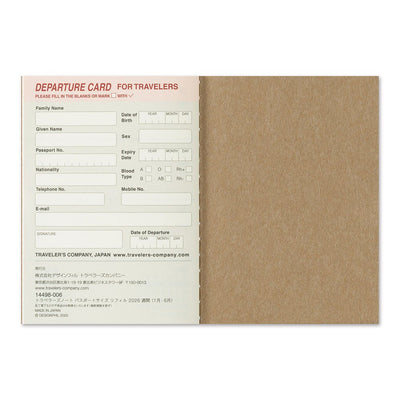 TRAVELER'S notebook passport size 2026 planner with horizontal week over two pages layout. Showing the card stock TRAVELER'S company departure card